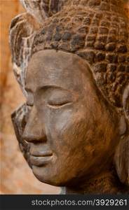 Face front of stone Buddha. Face front of stone Buddha seen in a temple in Angkor Wat