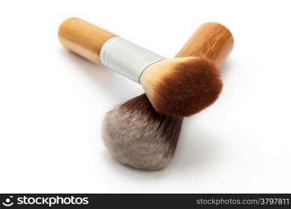 Face makeup brushes on white background