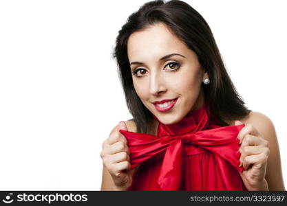 Face of a beautiful happy Caucasian Hispanic woman with red lipstick stretching satin bow-tie shirt, isolated.