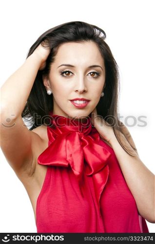 Face of a beautiful happy Caucasian Hispanic woman with red satin bow-tie shirt and red lipstick with hand in hair, isolated.