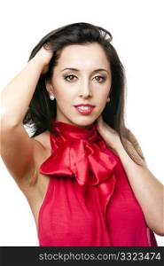 Face of a beautiful happy Caucasian Hispanic woman with red satin bow-tie shirt and red lipstick with hand in hair, isolated.
