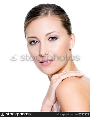 Face of a beautiful woman with clean skin on a white background