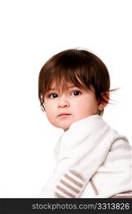 Face of a cute adorable baby infant toddler with innocent surprised expression looking over shoulder, isolated.
