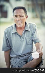 face of asian man relaxing emotion looking with eyes contact to camera
