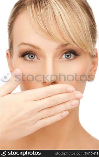 face of beautiful woman covering her mouth