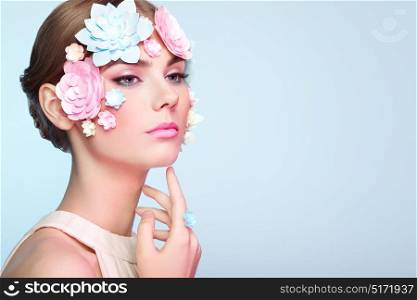 Face of Beautiful Woman Decorated with Flowers. Perfect Makeup. Beauty Fashion Model Woman Face perfect Skin. Paper Flowers