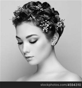 Face of beautiful woman decorated with flowers. Perfect makeup. Beauty fashion. Eyelashes. Cosmetic Eyeshadow. Black and White