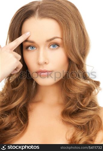 face of beautiful woman pointing at her forehead