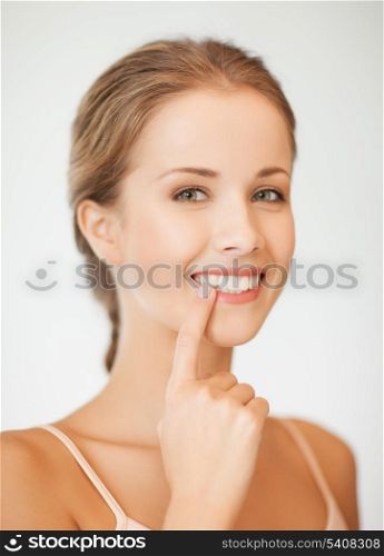 face of beautiful woman showing her teeth