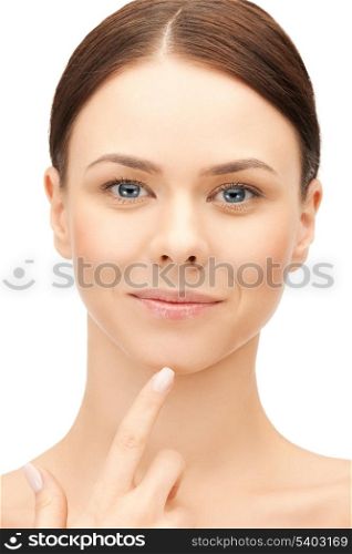 face of beautiful woman touching her chin