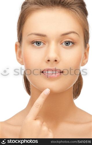 face of beautiful woman touching her chin