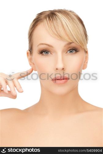 face of beautiful woman touching her ear