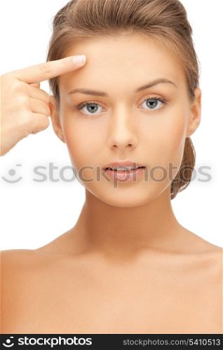 face of beautiful woman touching her forehead