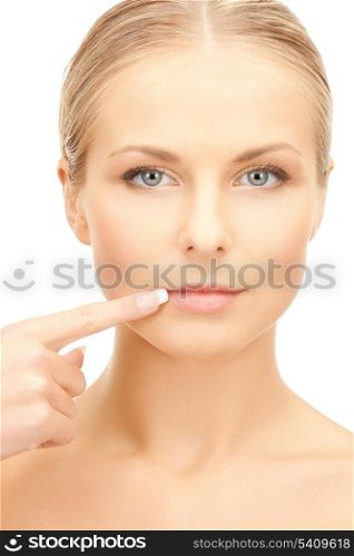 face of beautiful woman touching her lips