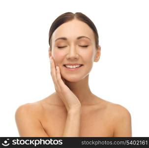 face of beautiful woman touching her skin