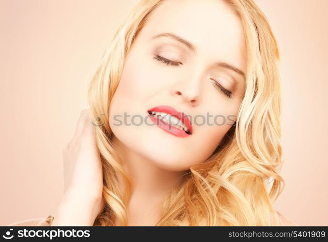 face of beautiful woman with long blonde hair