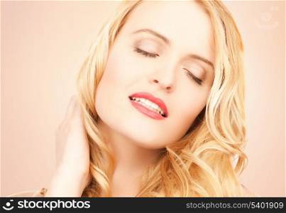 face of beautiful woman with long blonde hair