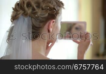 face of bride in mirror