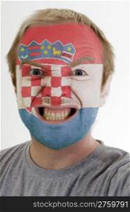 Face of crazy angry man painted in colors of Croatia flag