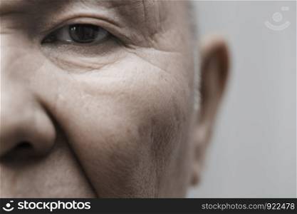 Face of elderly man looking at camera. Horizontal photo