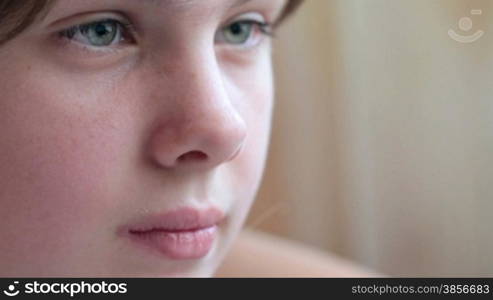 Face of girl looking at laptop monitor