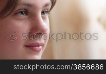 Face of girl looking at laptop monitor