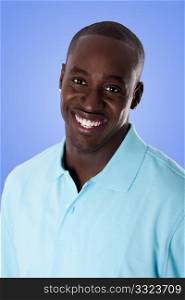 Face of handsome happy African American corporate business man smiling, wearing blue polo shirt, isolated.