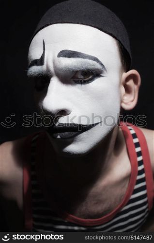 Face of mime fctor on black background
