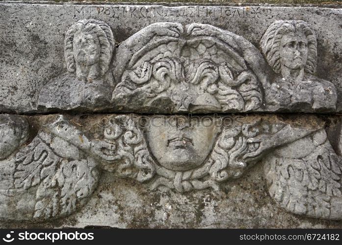 Face of statue on the marblewall in Iznik, Turkey