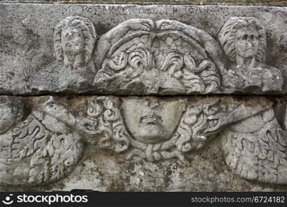 Face of statue on the marblewall in Iznik, Turkey