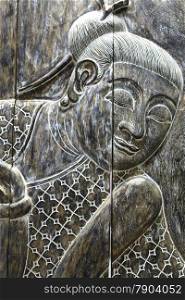 Face of the ancient wood Buddha close up