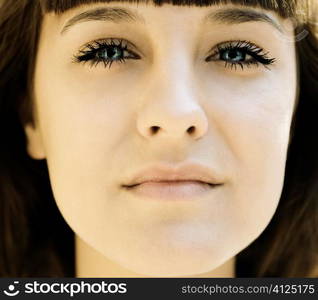 face of young woman in closeup, selective focus on eye