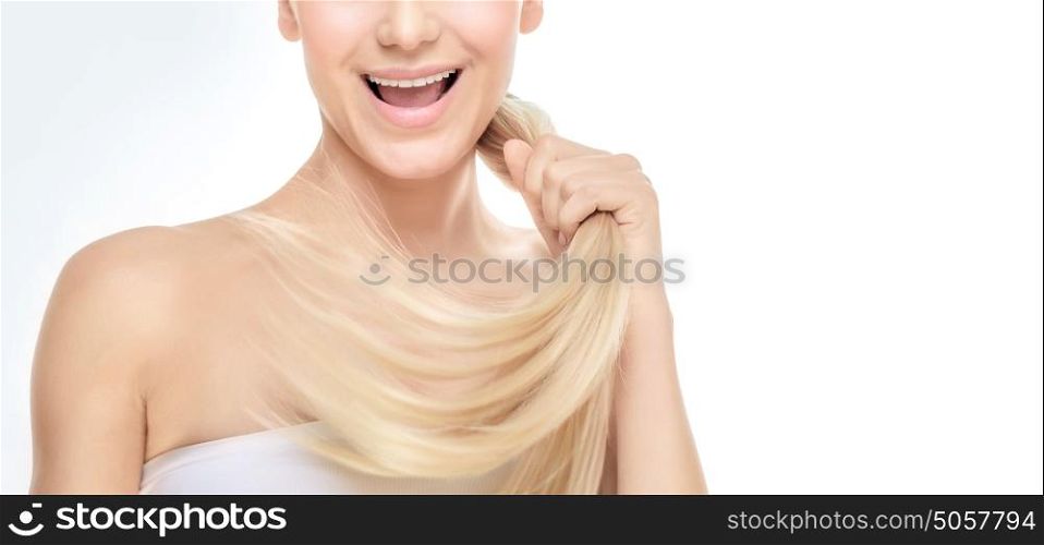 Face part of a happy blond girl with healthy shiny glossy hair over white grey background, photo with copy space, healthy hair concept