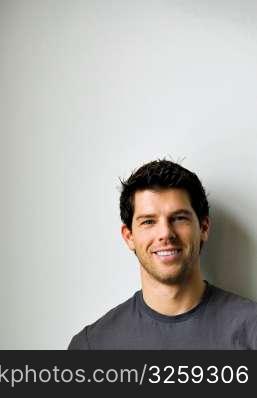 Face shot of a young smiling man.