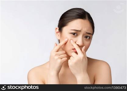 Face Skin Problem - young woman unhappy touch her skin isolated, concept for skin care, asian. Face Skin Problem - young woman unhappy touch her skin isolated, concept for skin care, asian.
