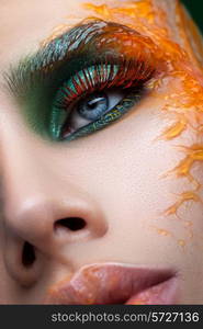 Face with creative make-up close-up