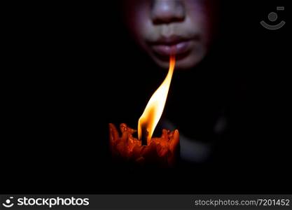 Face woman Blow out the candle at black background