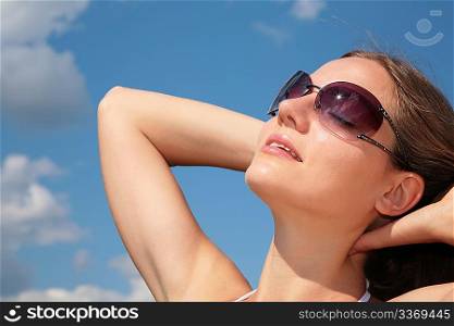 face woman with sunglasses on sky
