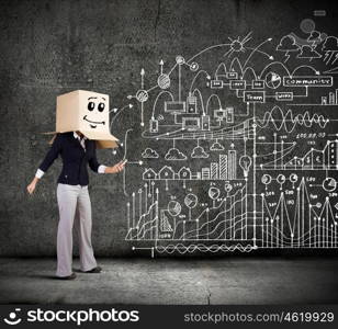 Faceless businesswoman. Businesswoman using mobile phone wearing carton box on head