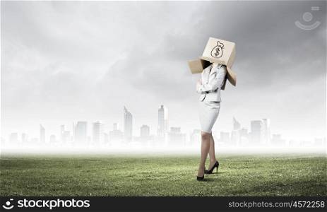 Faceless businesswoman. Businesswoman with carton box on head. Money concept