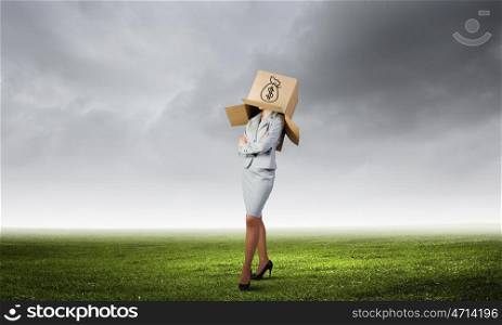 Faceless businesswoman. Businesswoman with carton box on head. Money concept