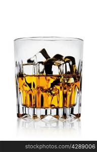 Faceted amber glass with whiskey on a white background