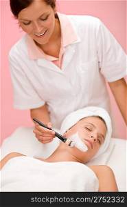 Facial mask - Woman at beauty treatment at luxury spa beauty treatment