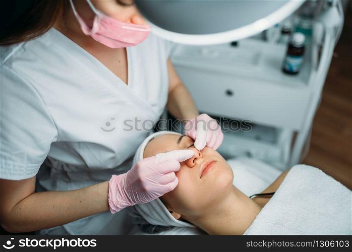 Facial skincare in spa salon, health care. Professional beauty medicine, rejuvenation procedure. Facial skincare in spa salon, health care