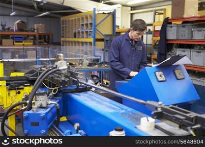 Factory Engineer Operating Hydraulic Tube Bender