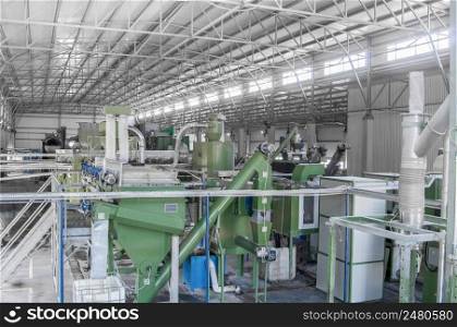 factory equipment for processing and recycling of plastic bottles. PET recycling plant. a plant for recycling bottles