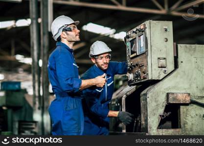 Factory machine maintenance service engineer team worker working together teamwork inspector in factory.