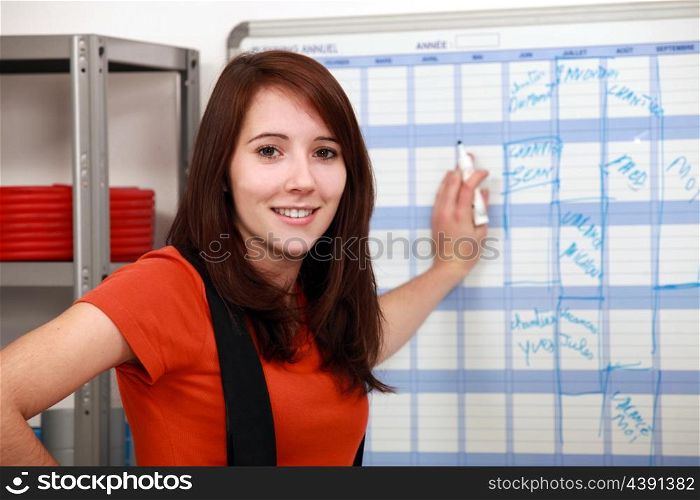factory worker filling the schedule