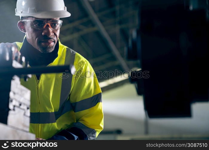 Factory worker or engineer do machine job in adept manufacturing workshop . Industrial people and manufacturing labor concept .. Factory worker or engineer do machine job in adept manufacturing workshop