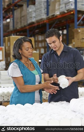 Factory Worker Training Colleague On Production Line